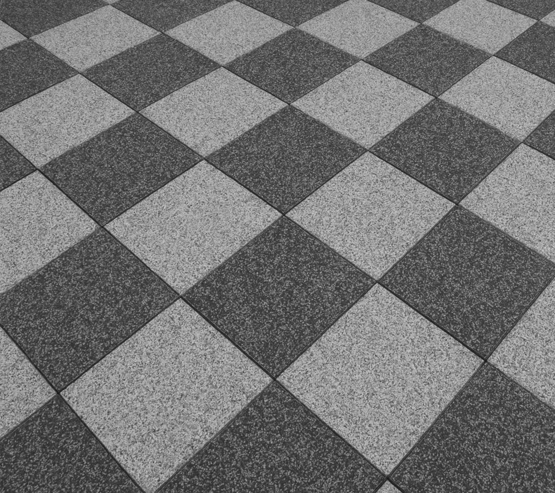 Taras granitowy we wzór szachownicy w romb, gdzie płytki obrócono o 45 stopni, tworząc dynamiczny efekt